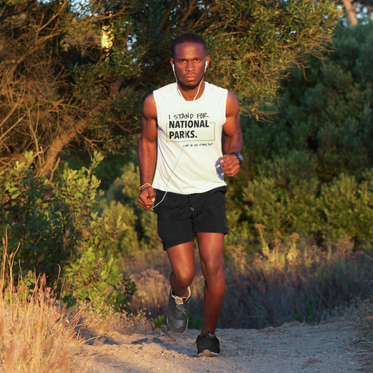 Man running on a trail with 'I Stand For National Parks' shirt