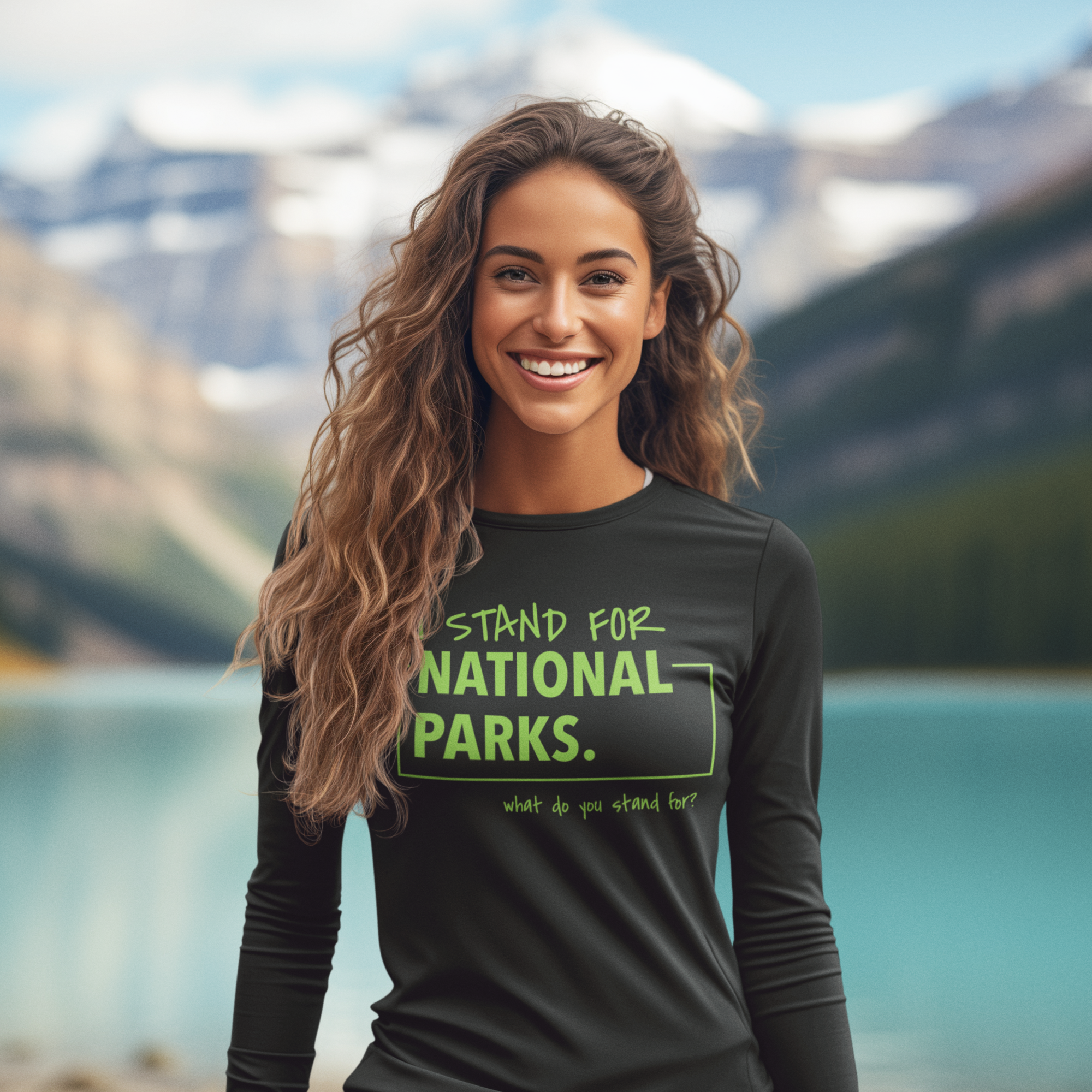 Woman wearing a shirt supporting national parks with a mountain and lake background