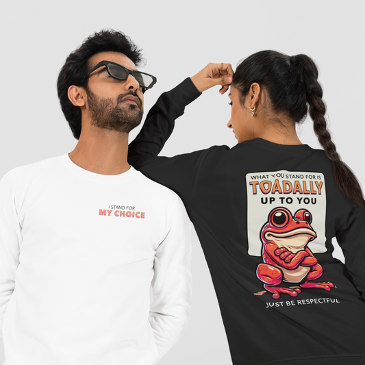 Two people wearing sweatshirts with humorous text and graphics on a plain background